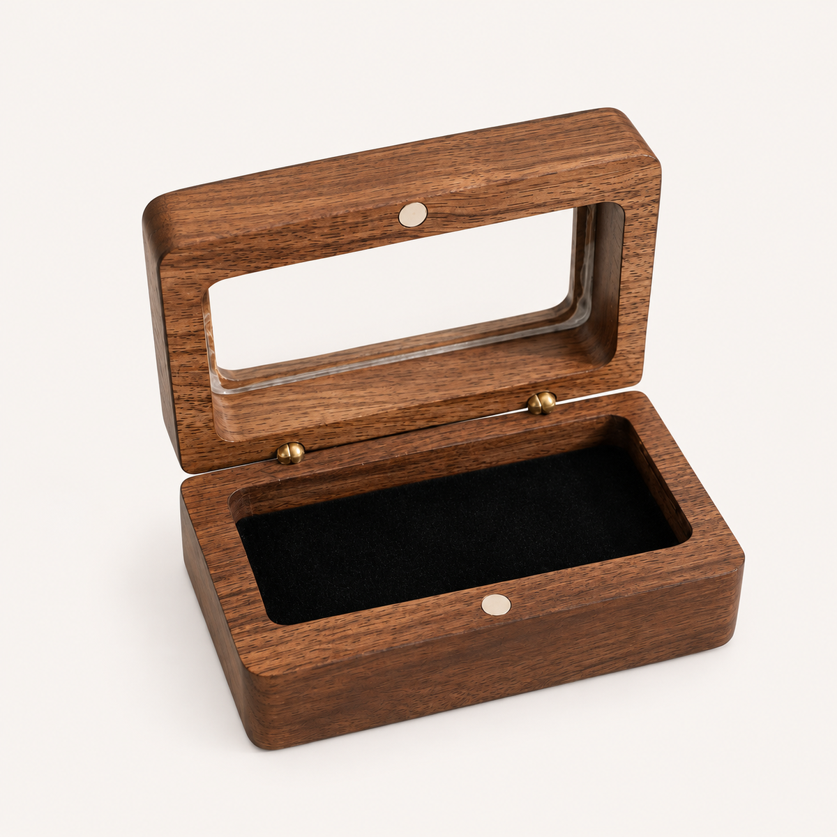 A rectangular wooden display box with an open hinged lid, featuring a clear glass window on the lid, a dark wood grain finish, brass hinges, and a black velvet-lined interior, shown on a light off-white background.